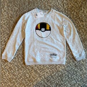 H&M Sweatshirt with Pokémon Pokeball sequin motif. Kids size: 8-10Y.